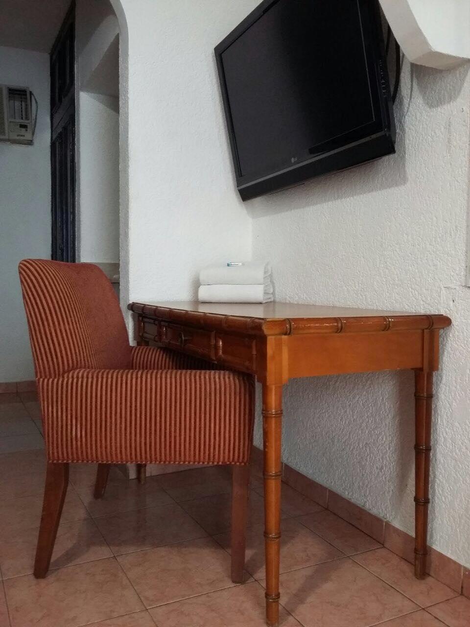 Capital O Zona Dorada Inn, Hotel